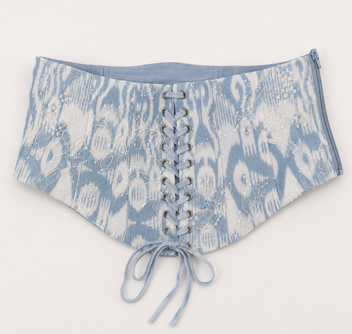 Sadri Couture Marvorid Waist Corset in blue reversible ikat lace, styled lifestyle photo.