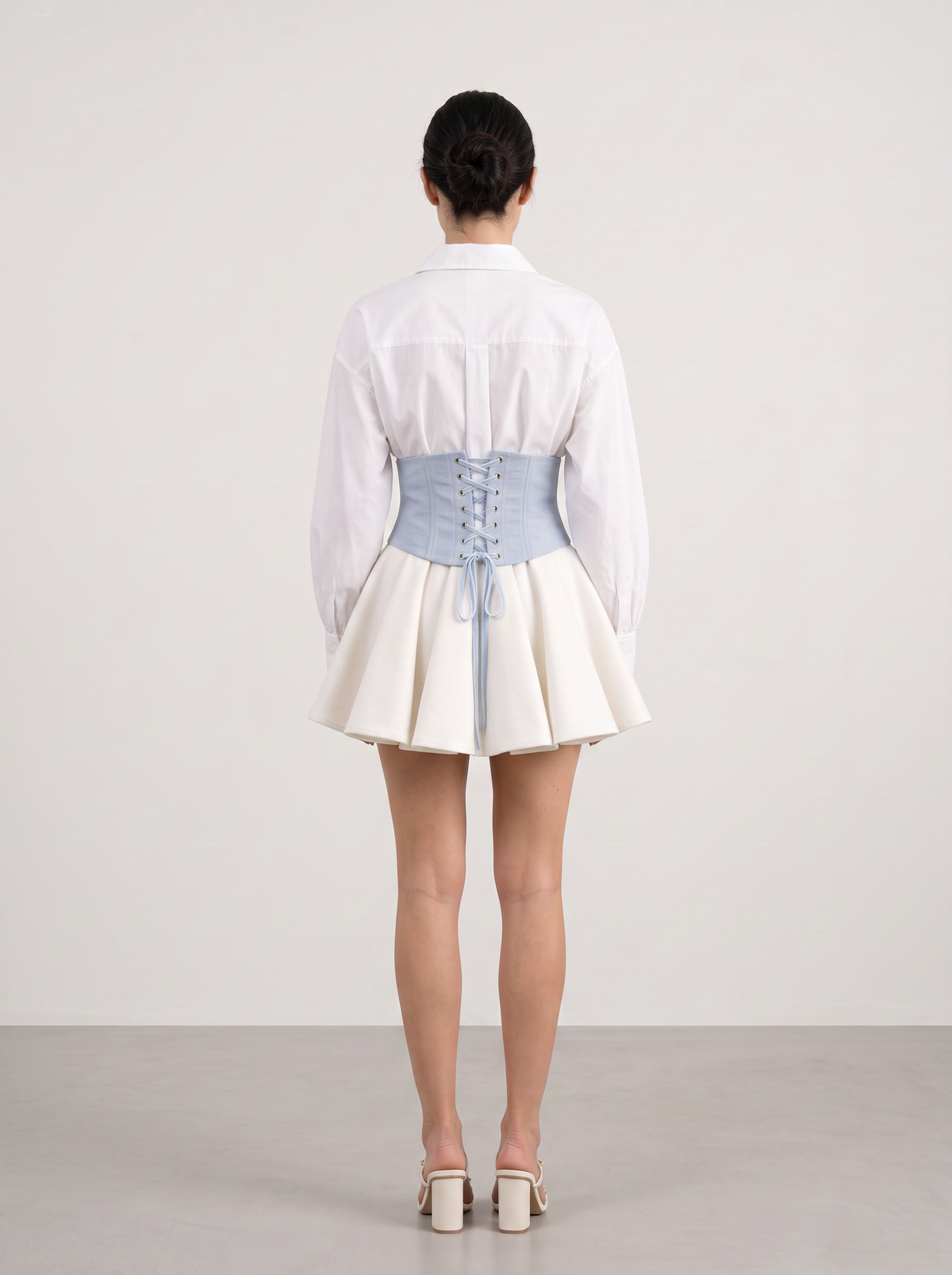 Sadri Couture Marvorid Waist Corset in blue reversible ikat lace, full-length styled photo.