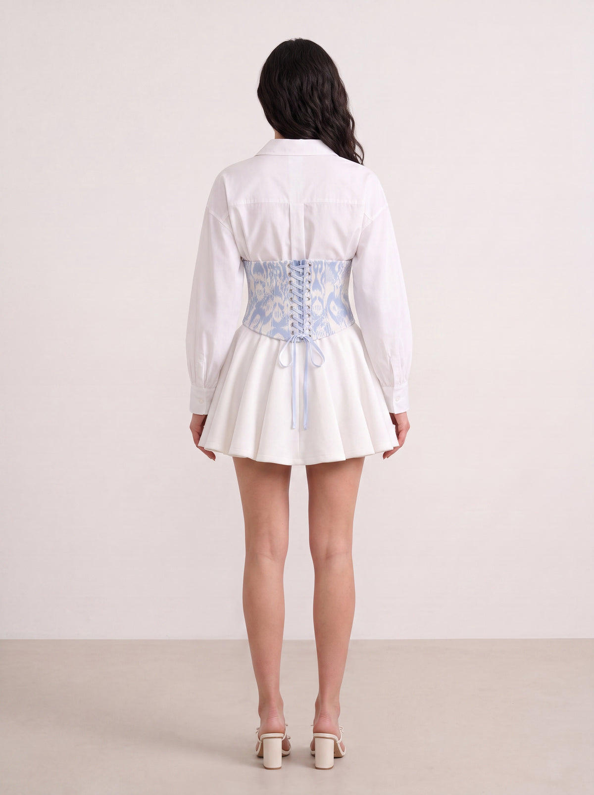 Sadri Couture Marvorid Waist Corset in blue reversible ikat lace, side detail view.
