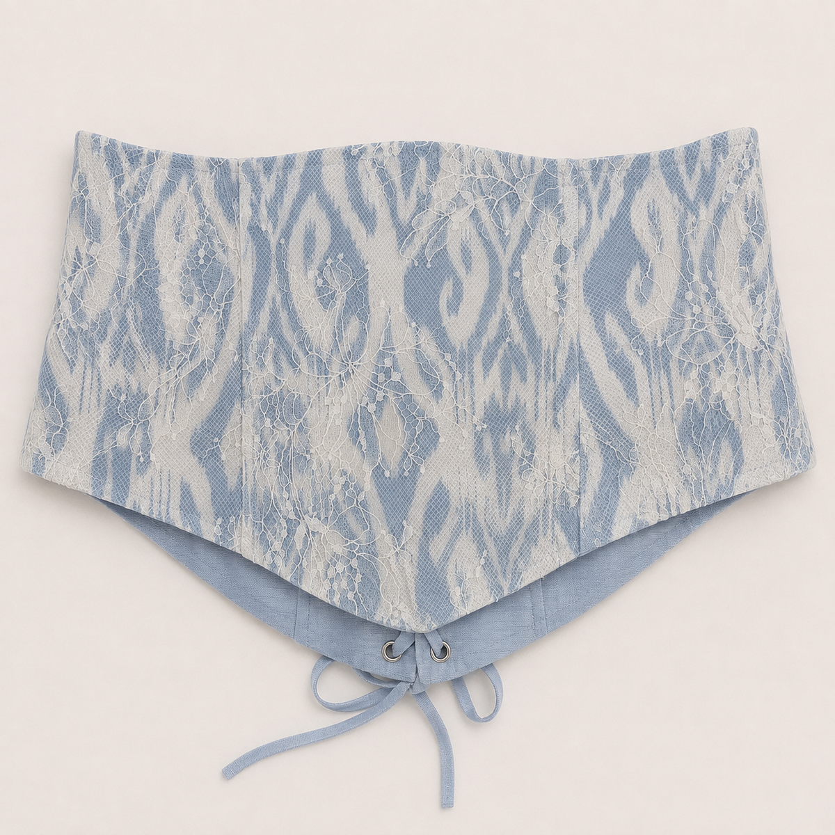 Sadri Couture Marvorid Waist Corset in blue reversible ikat lace, close-up of fabric and hardware detail.